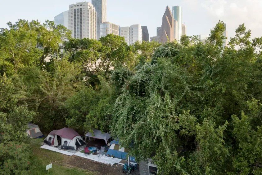 A large homeless camp near downtown Houston in 2019. Mayor Sylvester Turner said homeless shelters have become a hot spot for coronavirus. Health officials advise against moving homeless encampments during the pandemic, though they suggest homeless people have 144 square feet of space per person